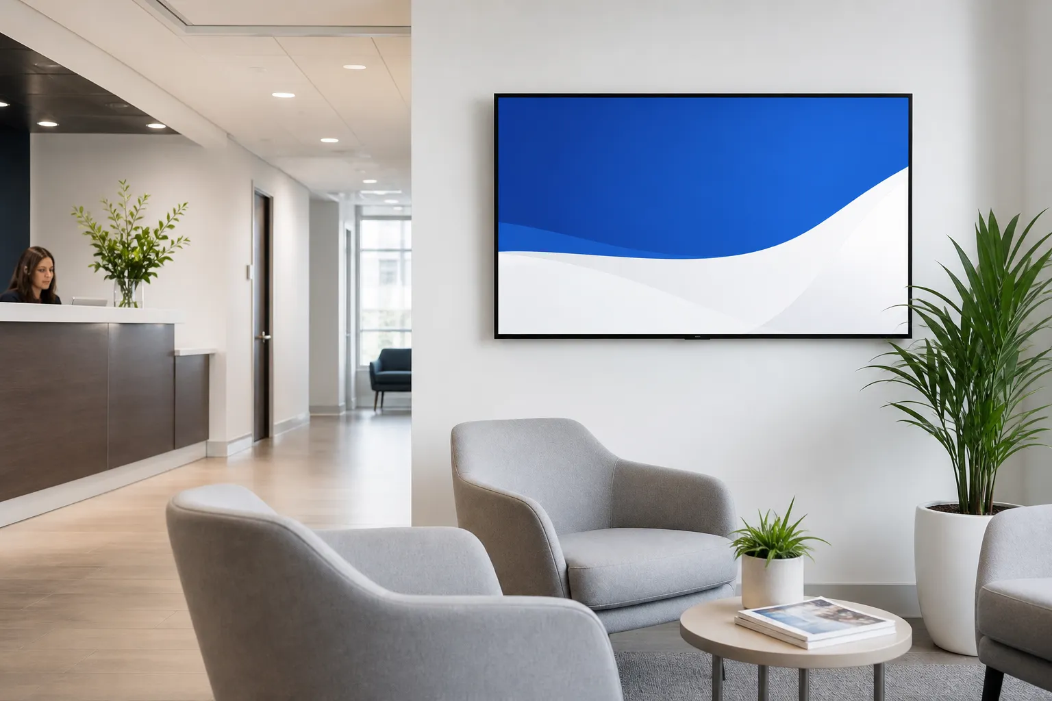 Digital welcome screen in a bright, modern business reception area